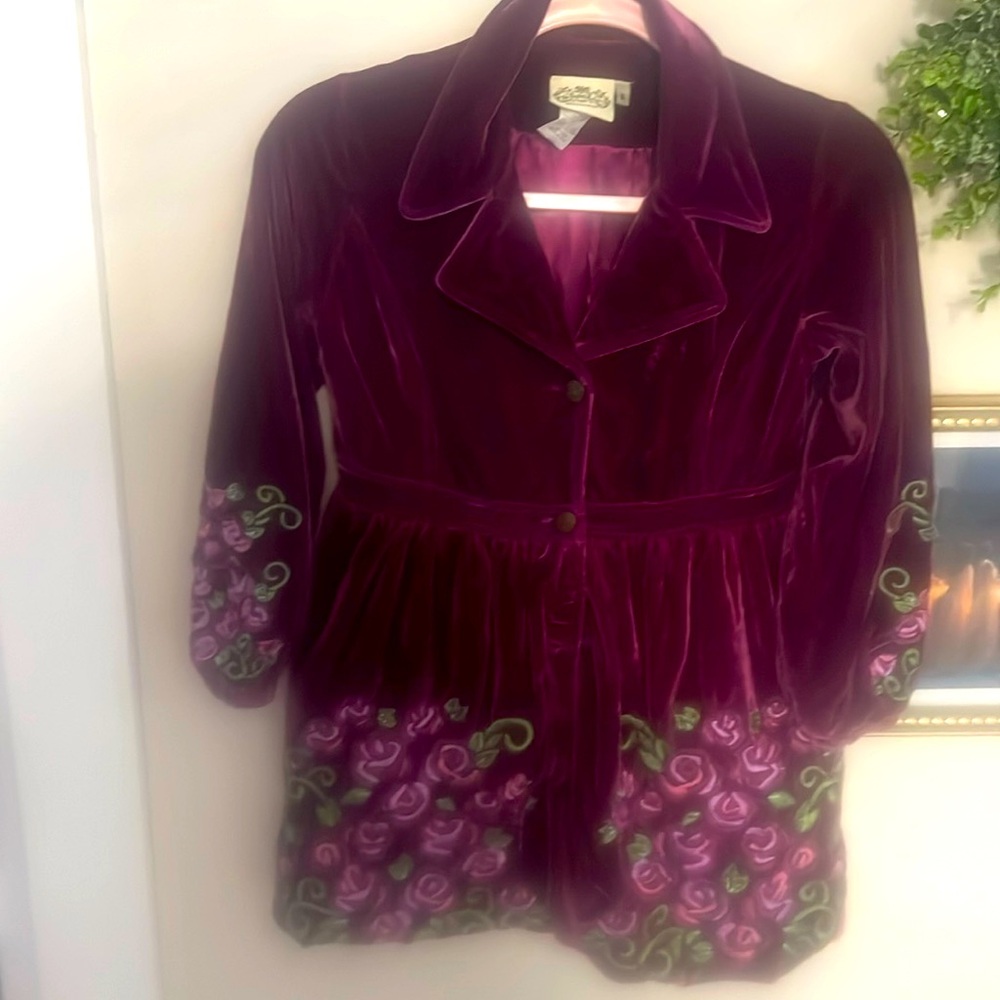 Plum velvet girls jacket with embroidered roses along sleeves and front.
